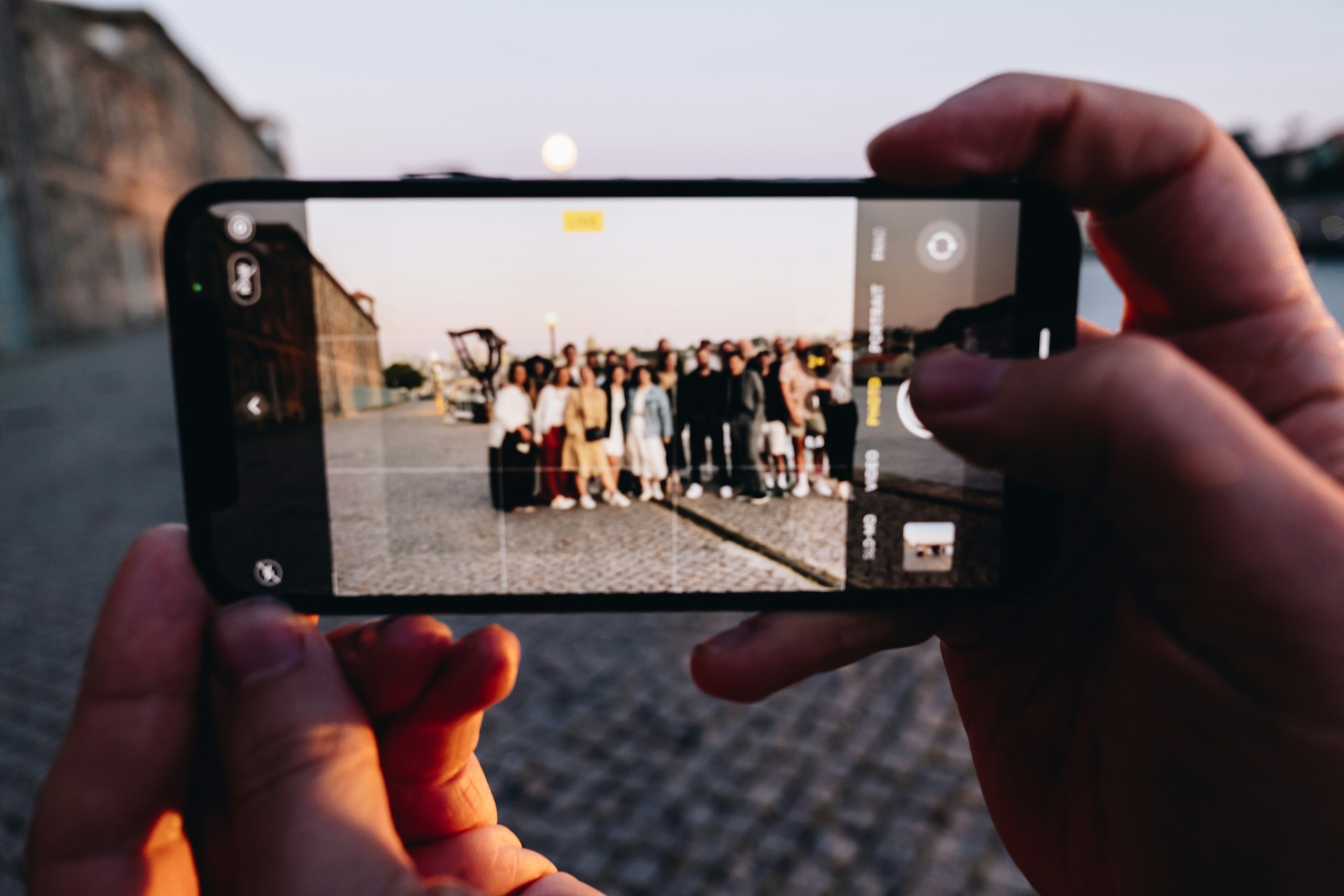 An image of someone taking a team photo during Sketch’s annual company meetup in Porto.