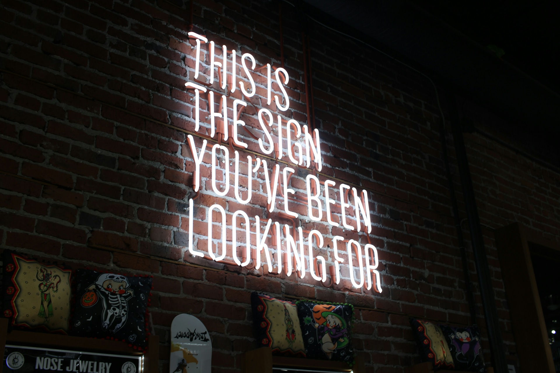 A pink neon sign used to illustrate the power of typography.